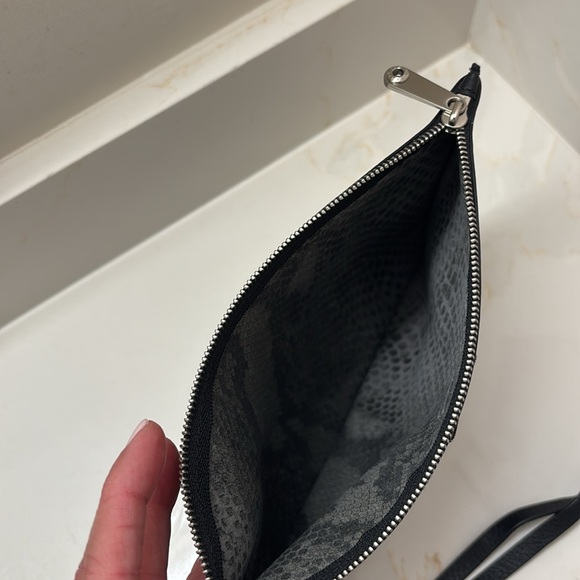 Henri Bendel NEW YORK Small black leather pouch with handle.